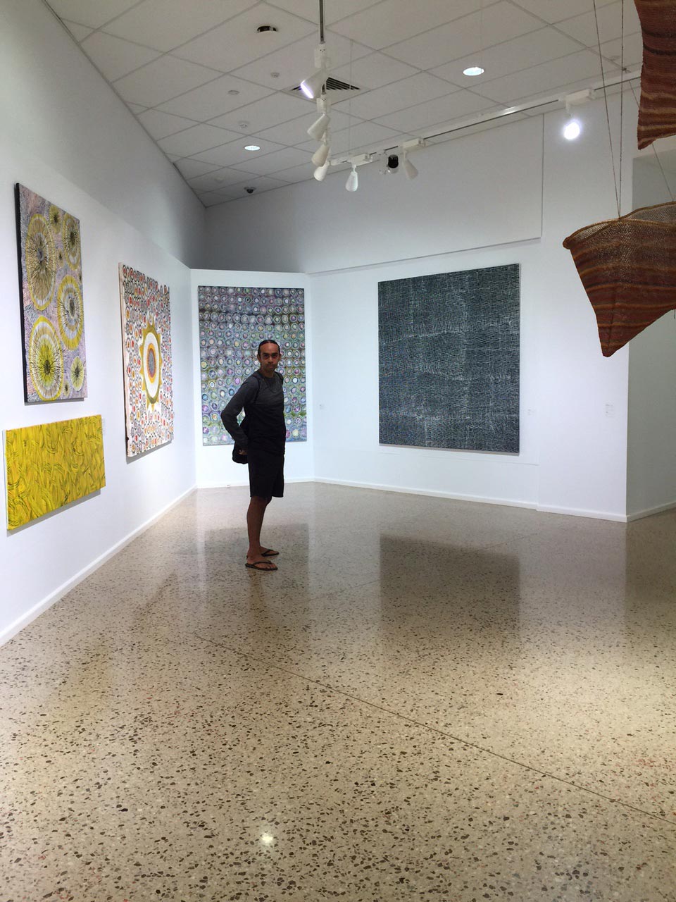 Merrepen Arts Aboriginal artist Kieren Karritpul at his exhibition Painting My Country Painting My Culture at Godinymayin Yijard Rivers Arts & Culture Centre