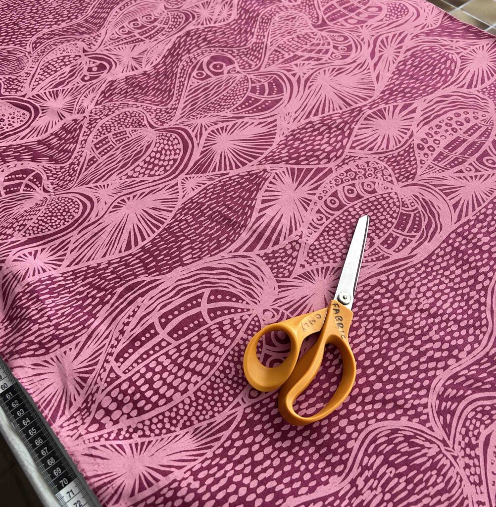 Nola Jimarin - Yams on deep pink linen (per 1m)