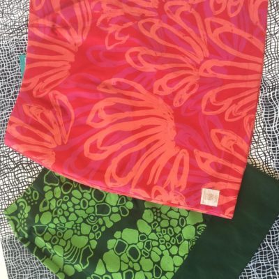 Merrepen Arts printed skirts in red and green.